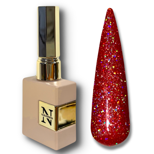 Stilettoformad nageltipp me glittrigt rött nagellack med tillhörande flaska.